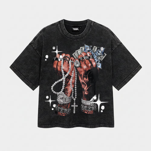 Black t-shirt with graphic of hands holding jewelry on a white background